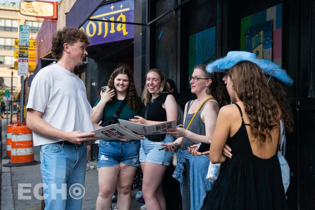 Will Linley passing out Gingerbread Times to fans