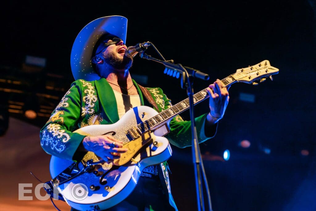 Photo of Orville Peck performing in Boston